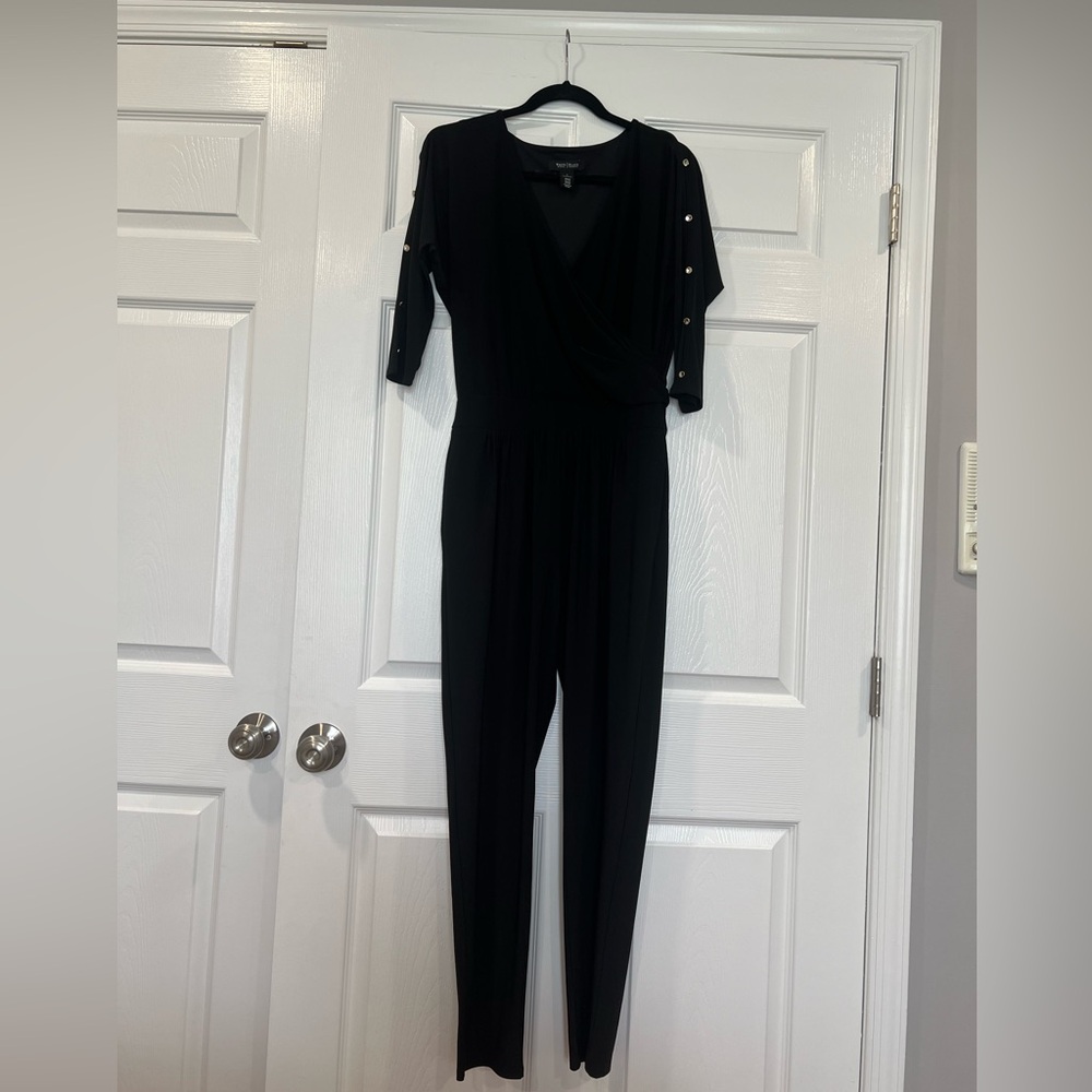 White House Black Market black stretch knit Surplice jumpsuit.